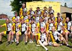 Group of Tour Charles Bruneau riders waving 